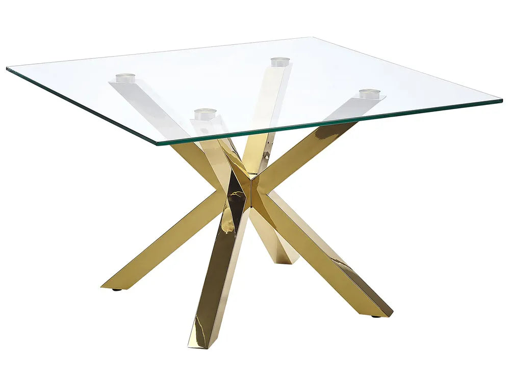 Glass table with gold metal legs on a white background