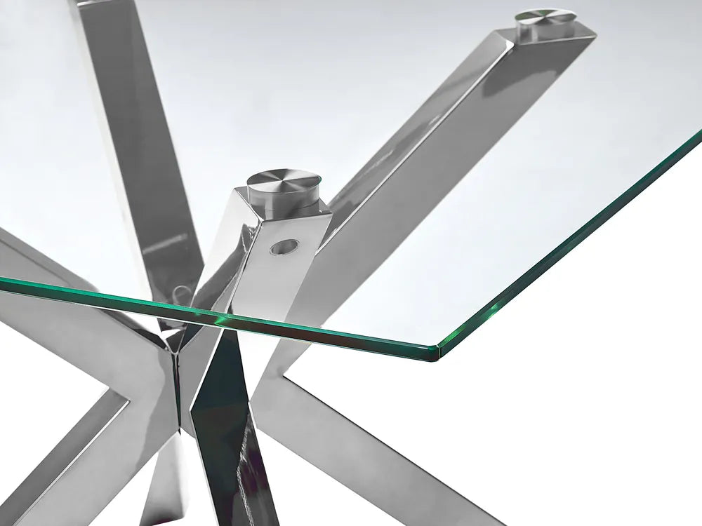 Glass table with metal base on a white background