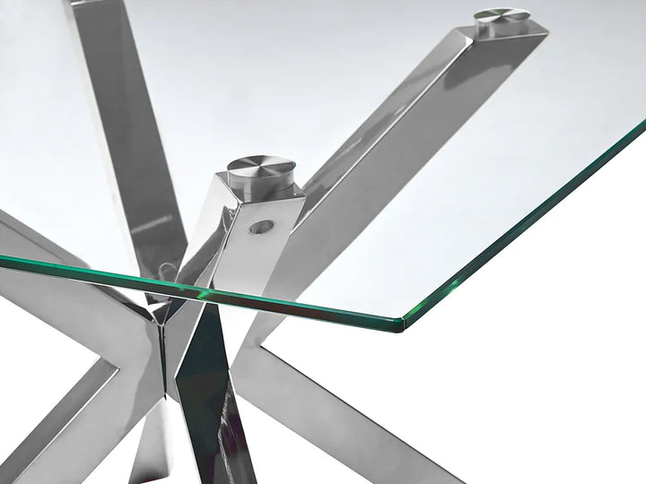 Glass table with metal base on a white background