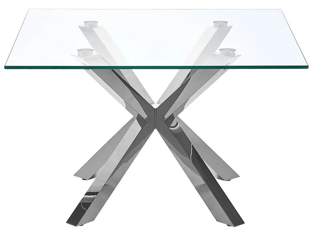 Glass table with a chrome metal base on a white background