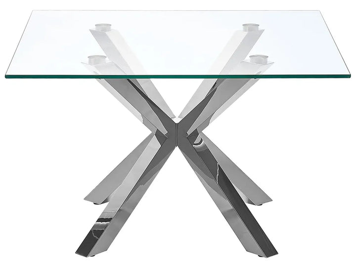 Glass table with a chrome metal base on a white background