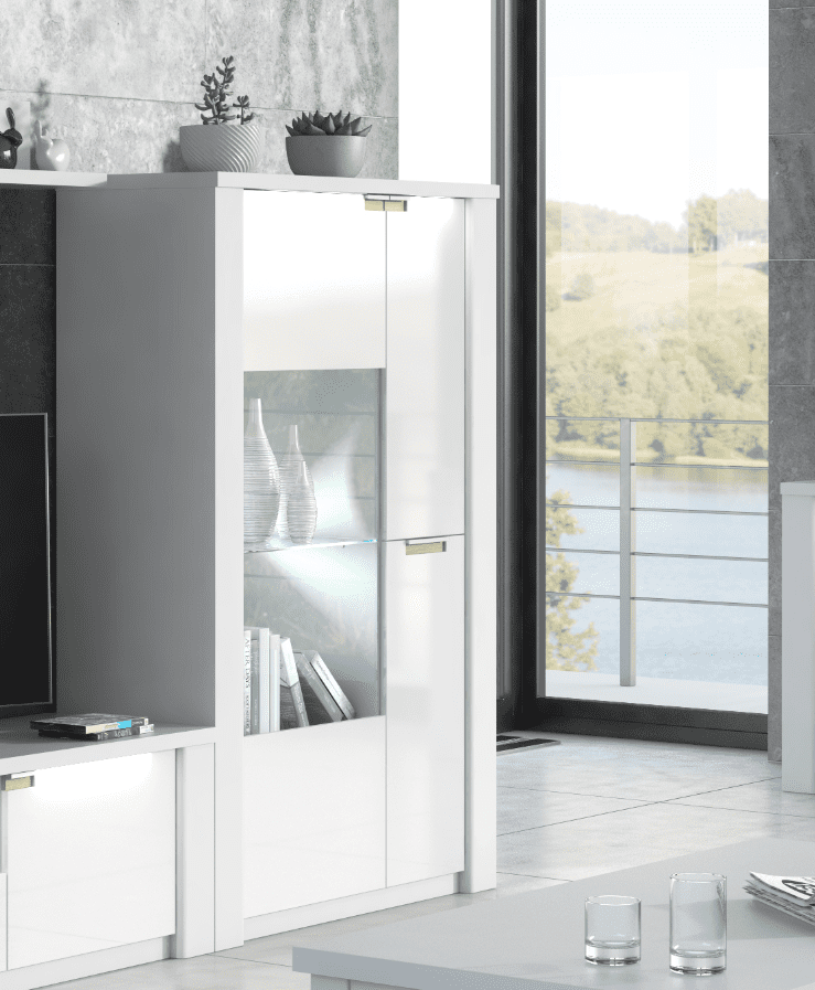 Modern interior with a white cabinet, television, and decorative items.