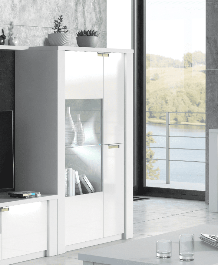 Modern interior with a white cabinet, television, and decorative items.