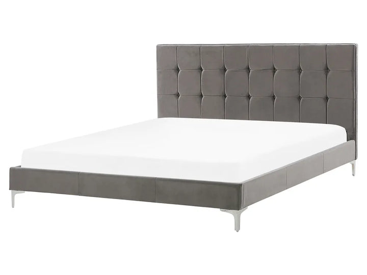 Gray upholstered bed with white mattress on a white background