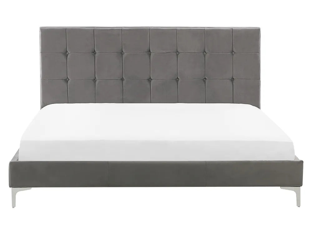 Gray upholstered bed with white mattress on a white background