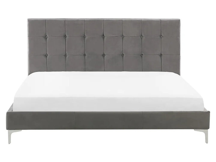 Gray upholstered bed with white mattress on a white background
