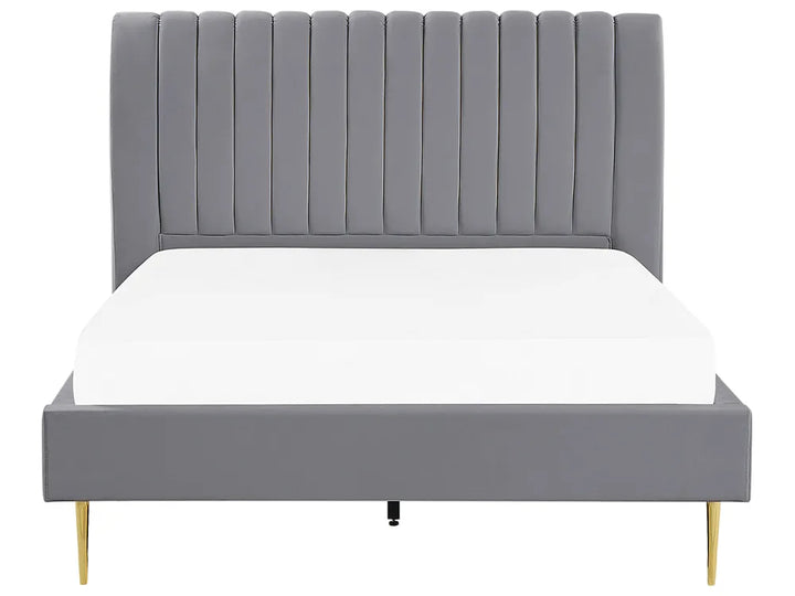 Gray upholstered bed with white mattress on a white background