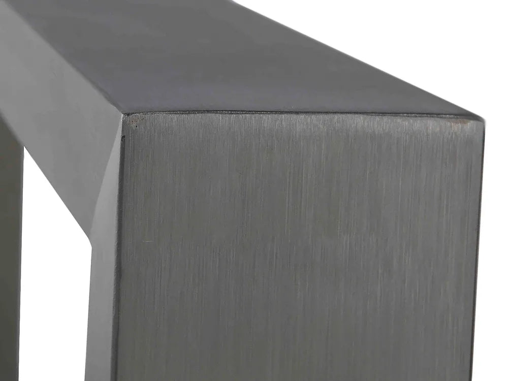 Close-up of a metallic surface with a brushed texture on a white background