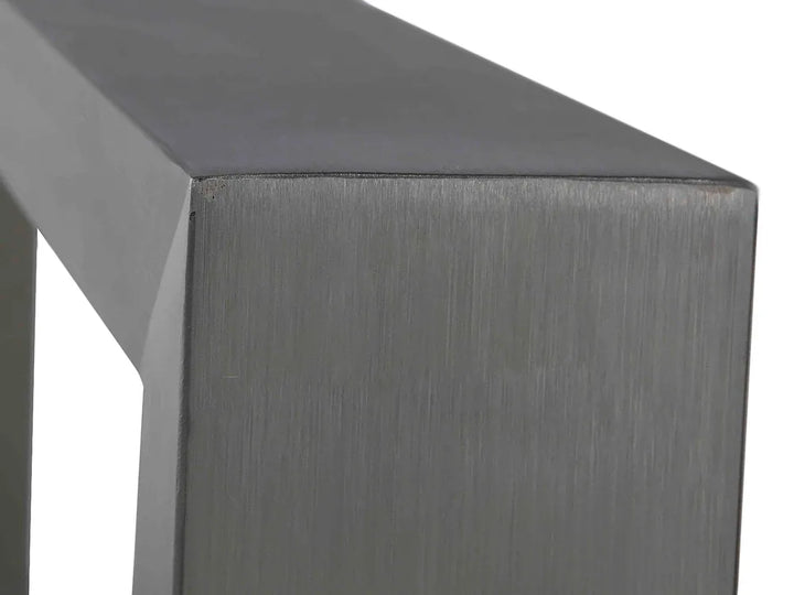 Close-up of a metallic surface with a brushed texture on a white background
