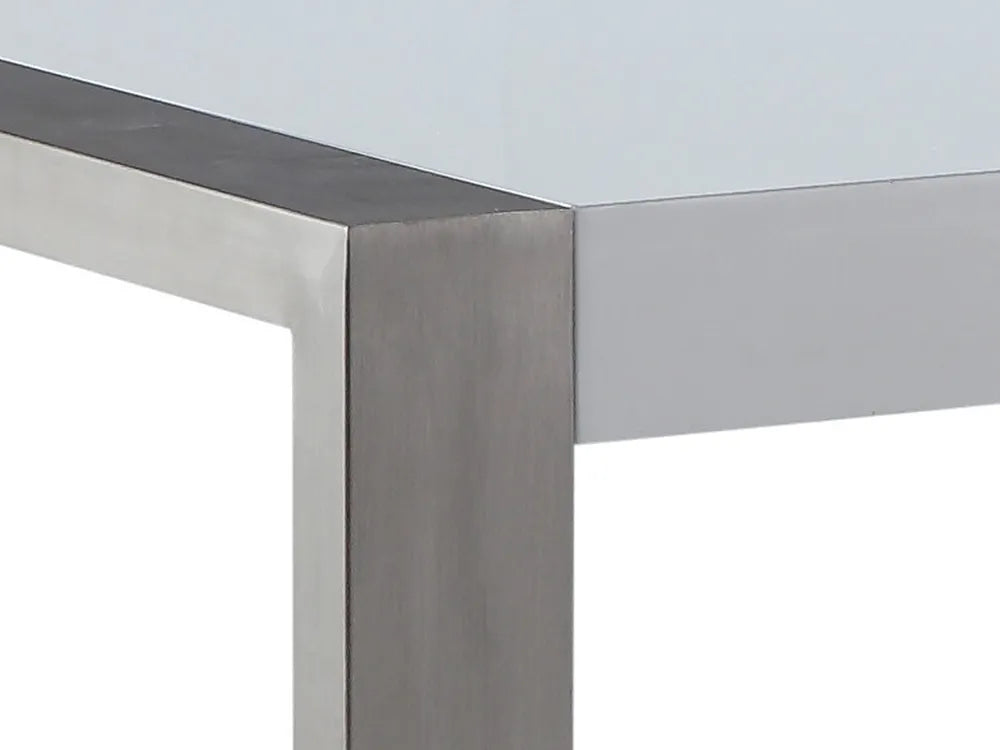 Close-up of a metallic table corner with a reflective surface.