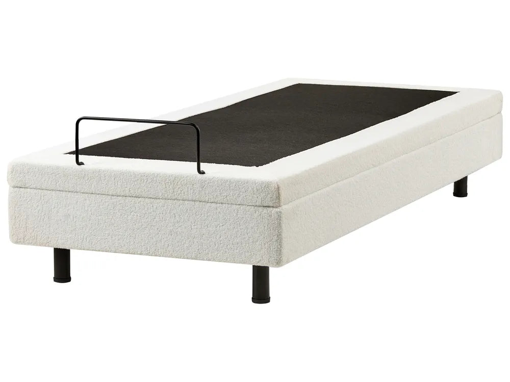 White bed frame with black mattress on a white background