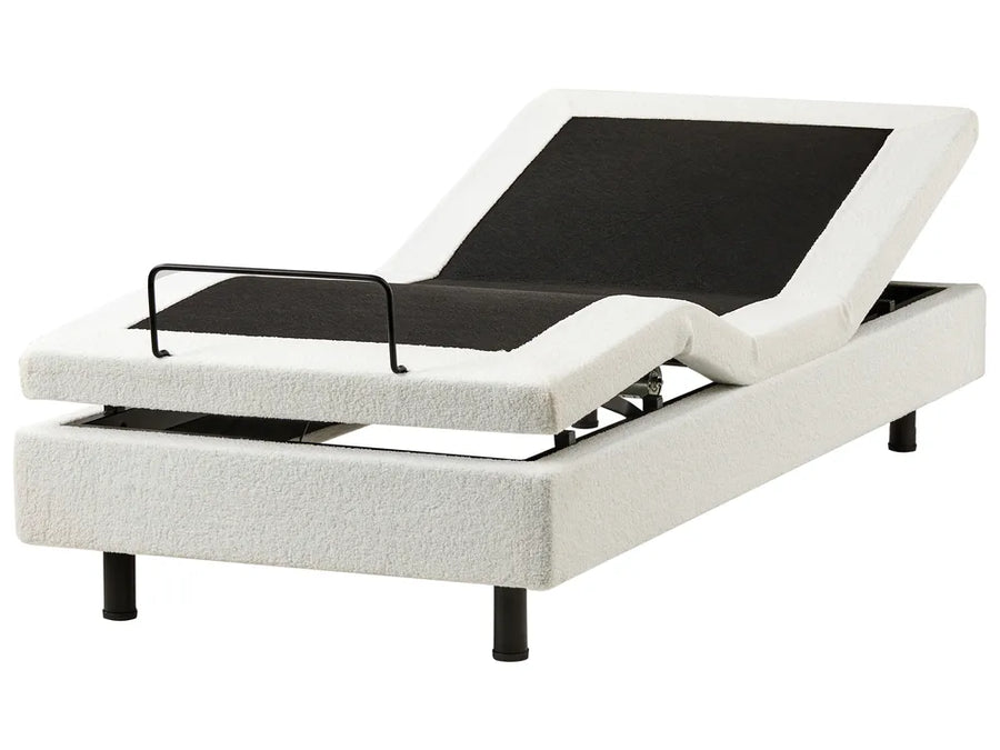 White adjustable bed base with black control panel on a white background