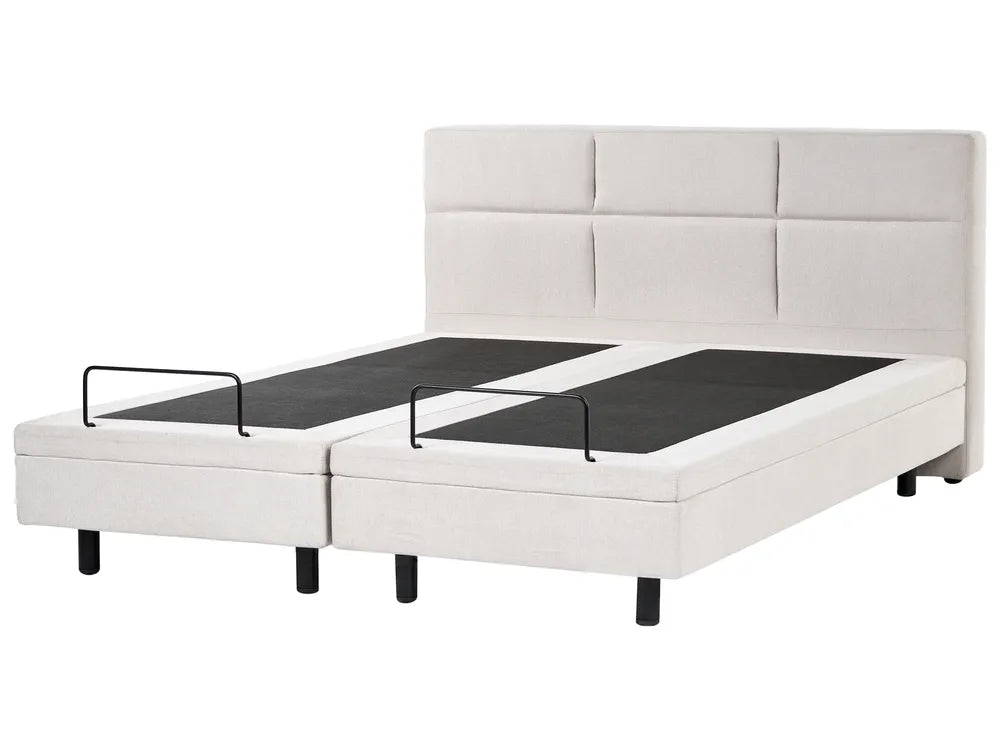 White upholstered bed with black mattress on a white background