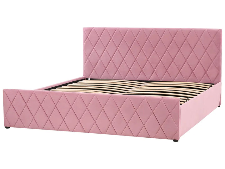Pink quilted bed with wooden slats on a white background