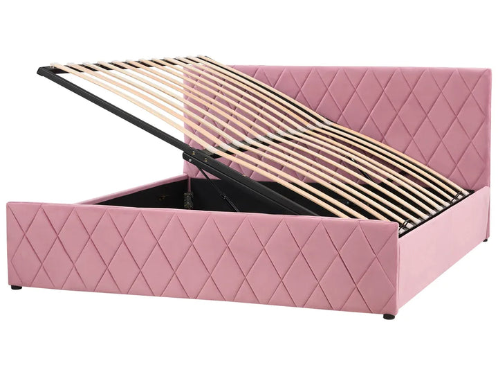 Pink quilted bed with open storage compartment on a white background