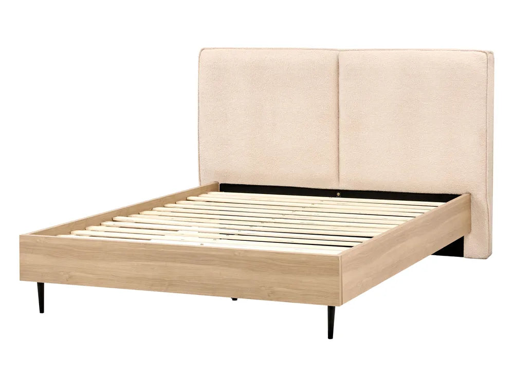 Beige upholstered bed frame with slatted bed base on a white background