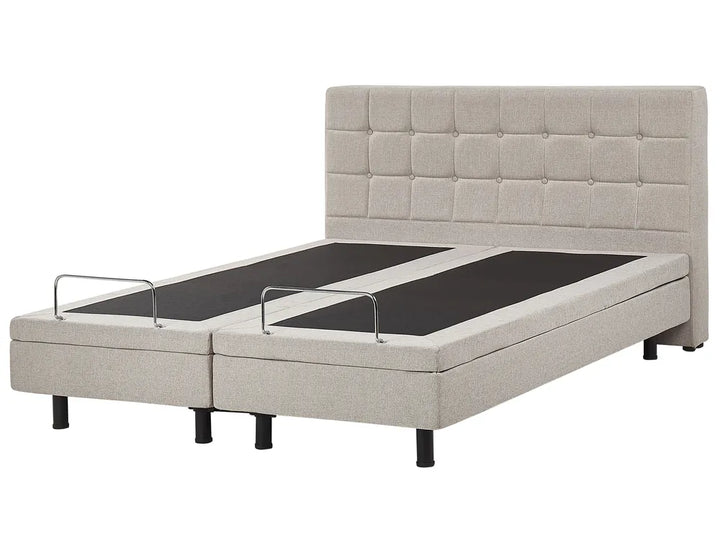 Beige upholstered bed with adjustable sections on a white background