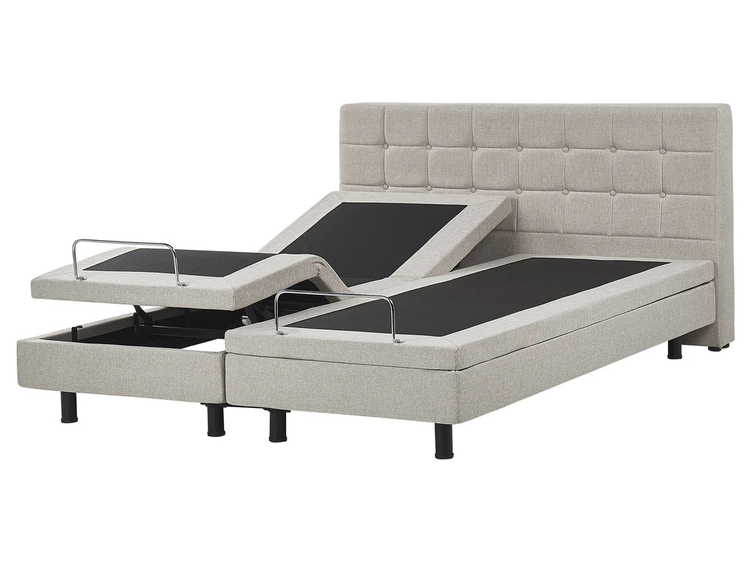 Adjustable bed with tufted headboard on a white background
