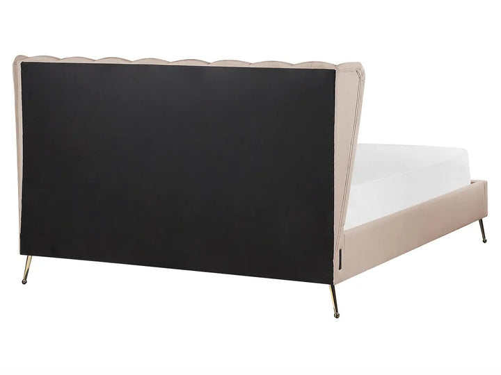 Bed with black headboard and beige sides on a white background