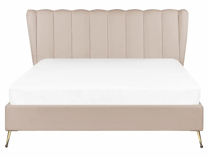 Beige upholstered bed with white mattress on a white background