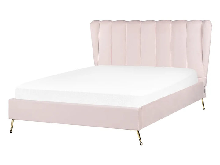 Pink upholstered bed with white mattress on a white background