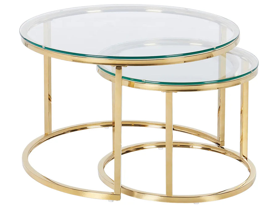 Set of two gold-framed glass tables on a white background