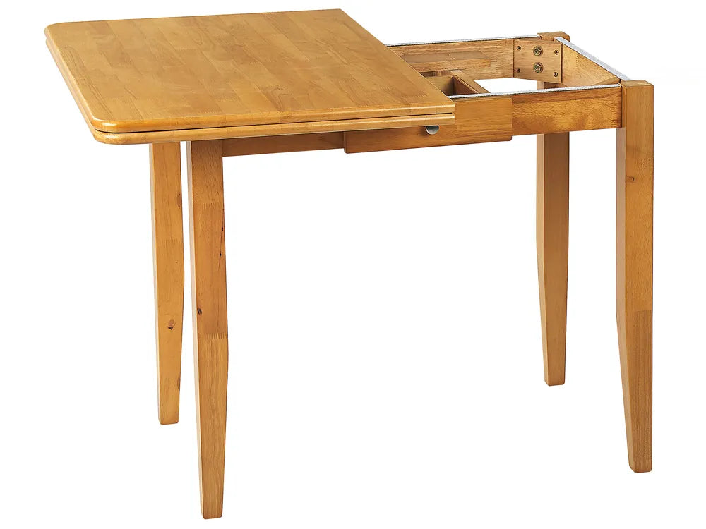 Wooden dining table with a drawer on a white background