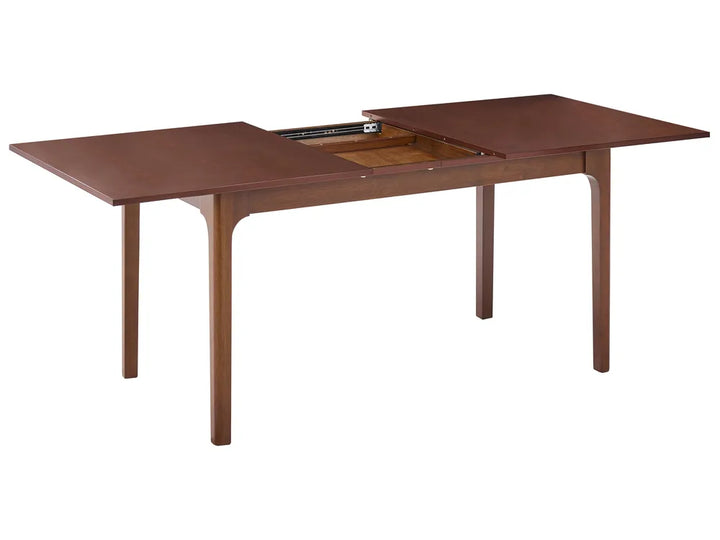 Wooden dining table with an extended leaf on a white background
