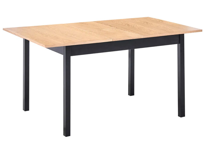 Table with wooden top and black metal legs on a white background
