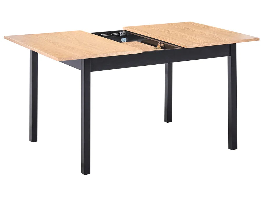 Dining table with wooden top and black metal legs on a white background
