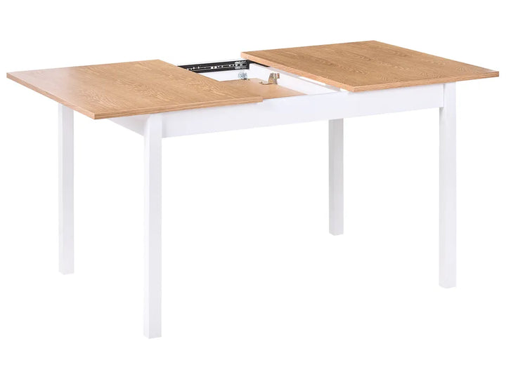 Wooden table with white legs on a white background