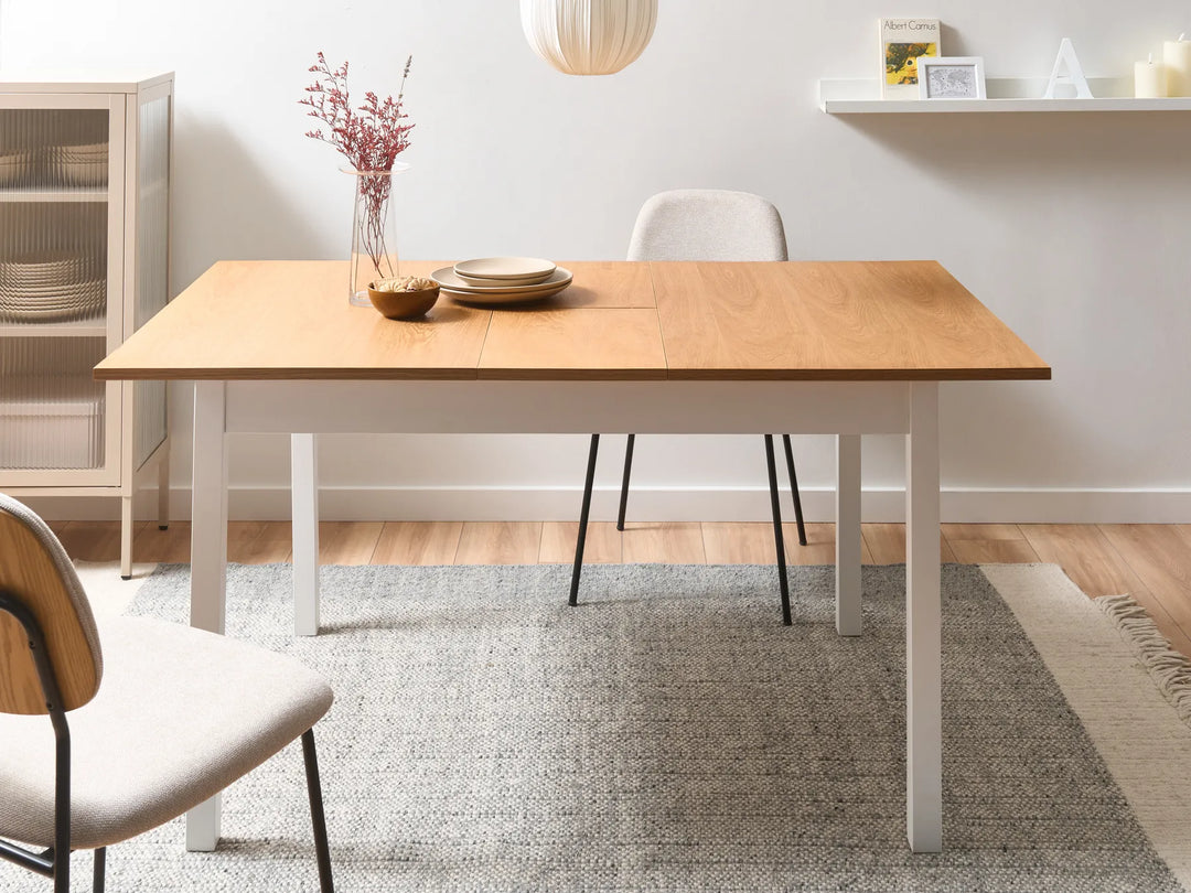 Dining room with wooden table and chairs on a gray rug
