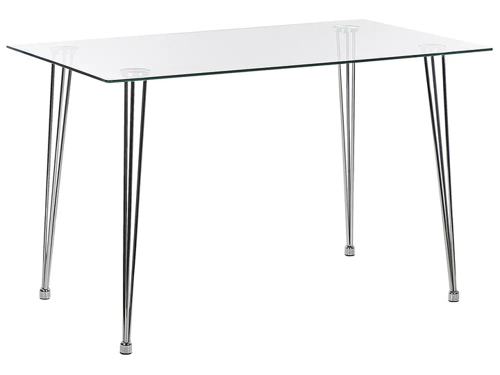 Clear glass table with metal legs on a white background