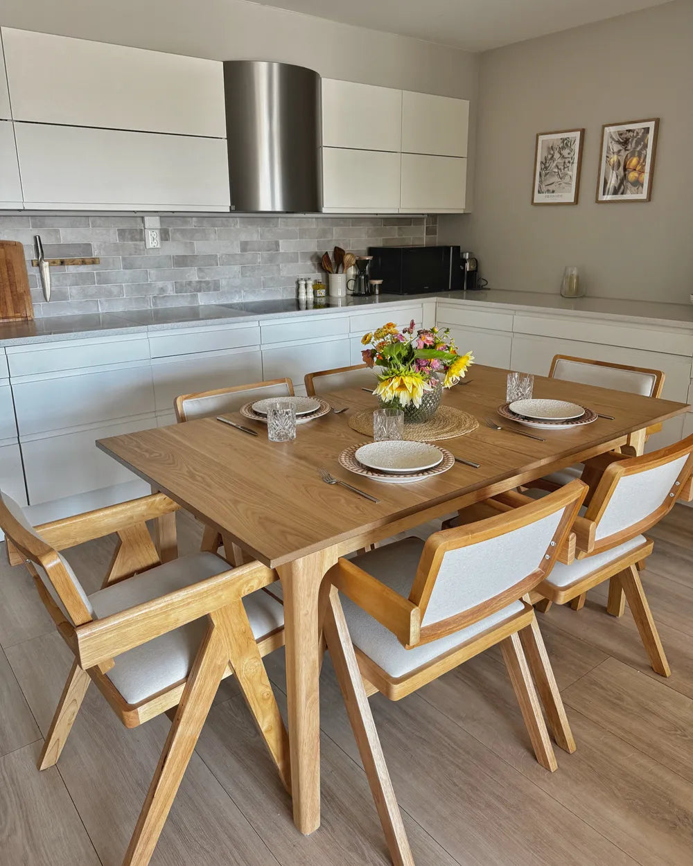 Dining area with wooden table and chairs in a kitchen setting