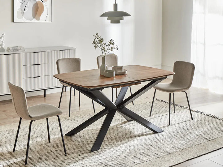 Dining room with a wooden table and chairs on a rug