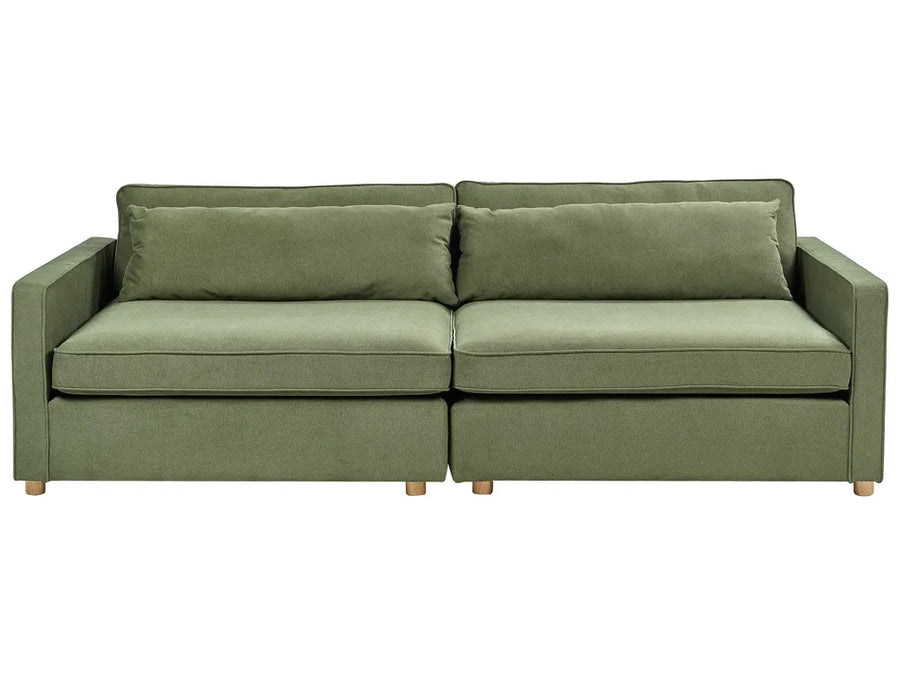 Green sofa with two cushions on a white background