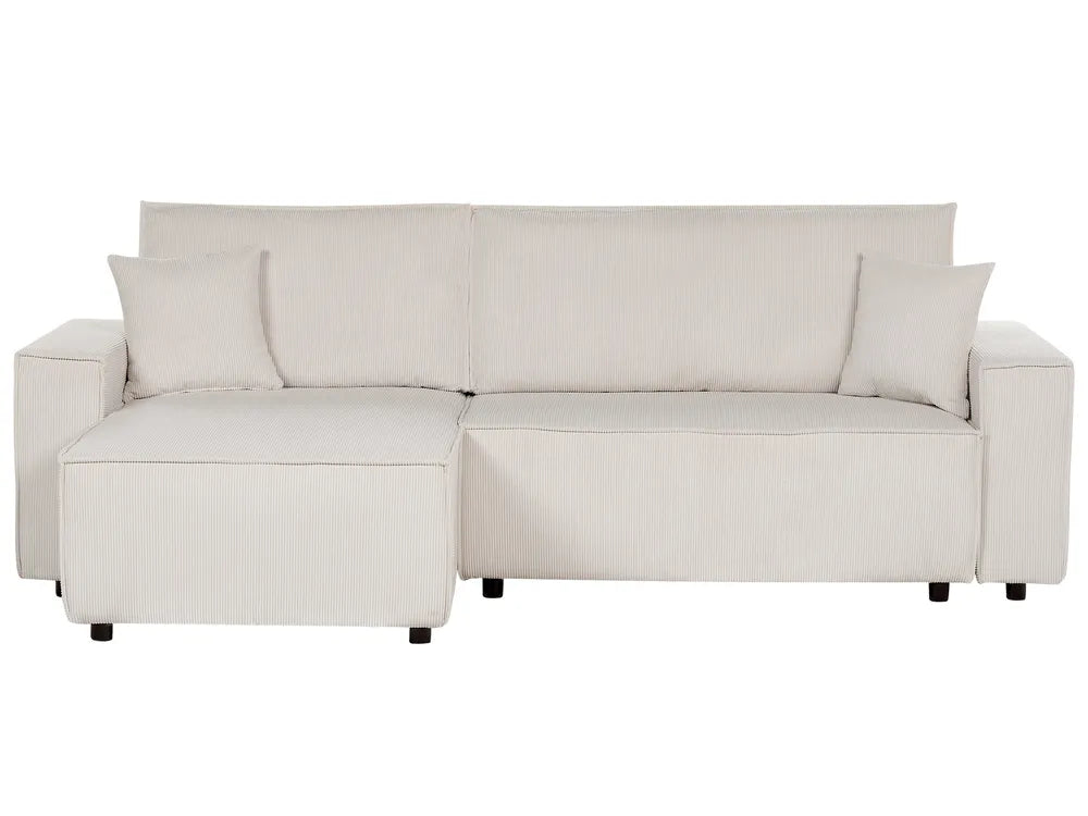 Beige sectional sofa with cushions on a white background