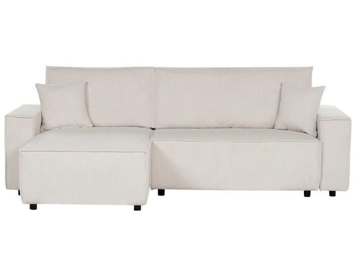 Beige sectional sofa with cushions on a white background