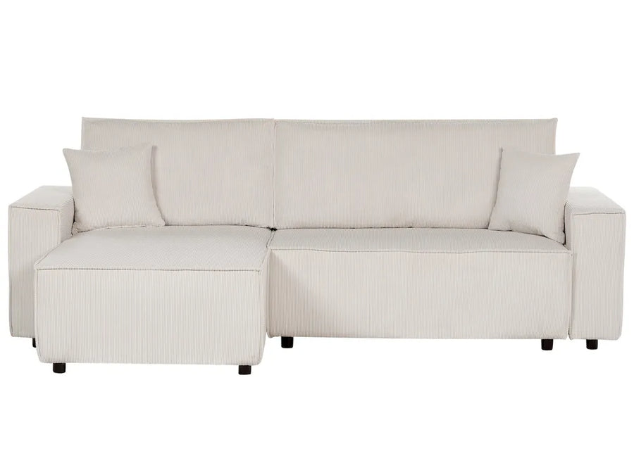 Beige sectional sofa with cushions on a white background