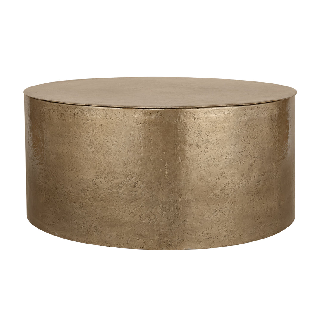 Round metallic gold coffee table on a white background