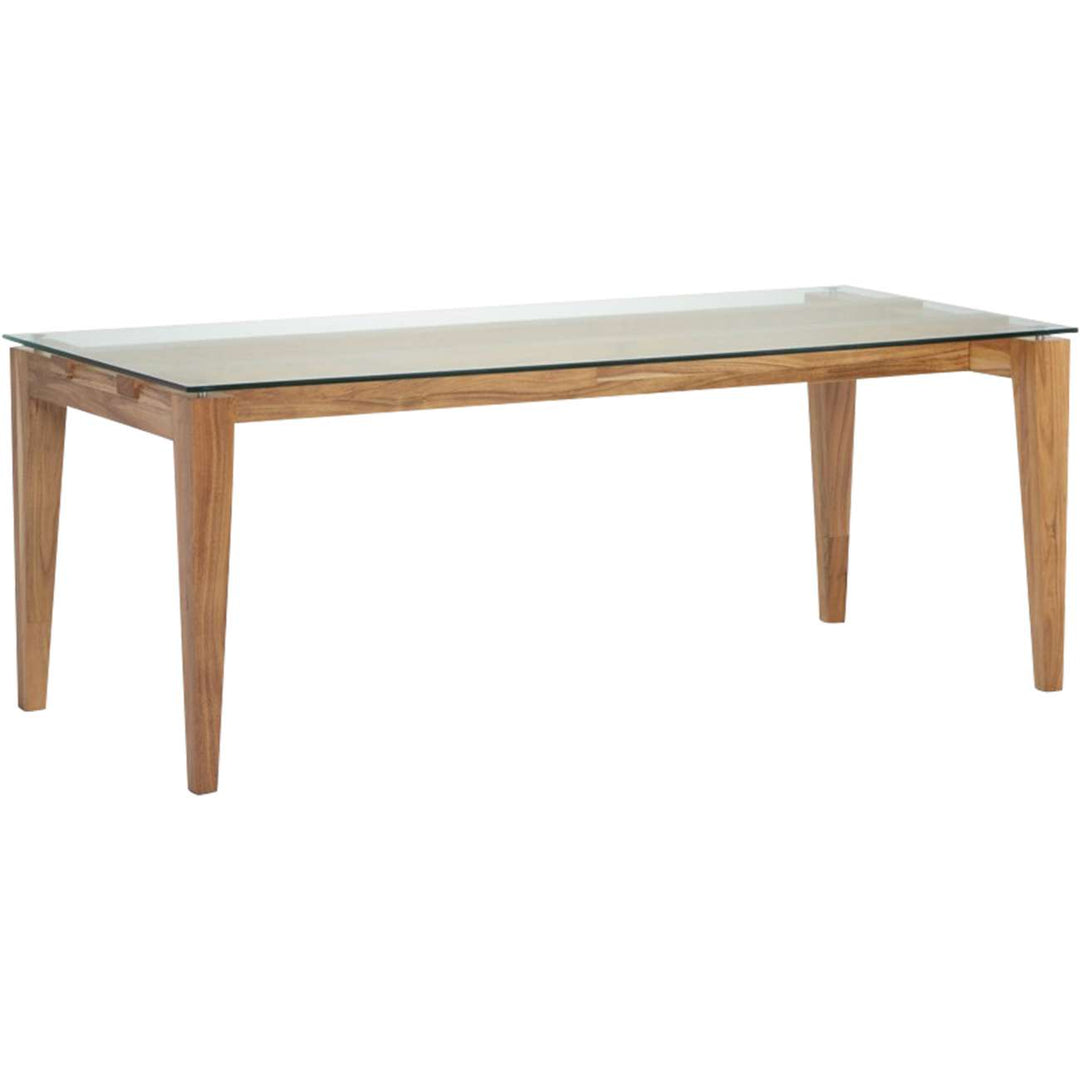 Dining table with glass top and wooden legs on a white background