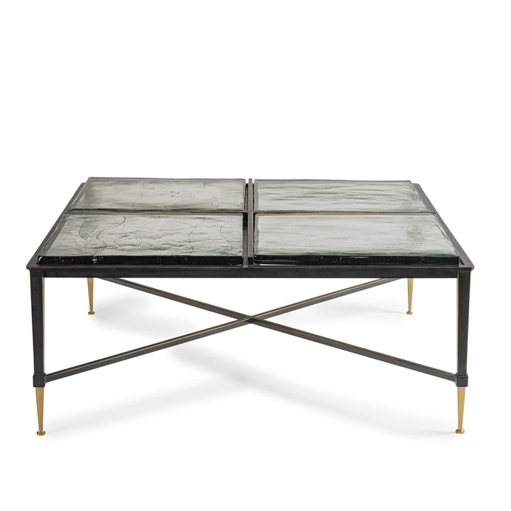 Modern coffee table with glass top and metal frame on a white background