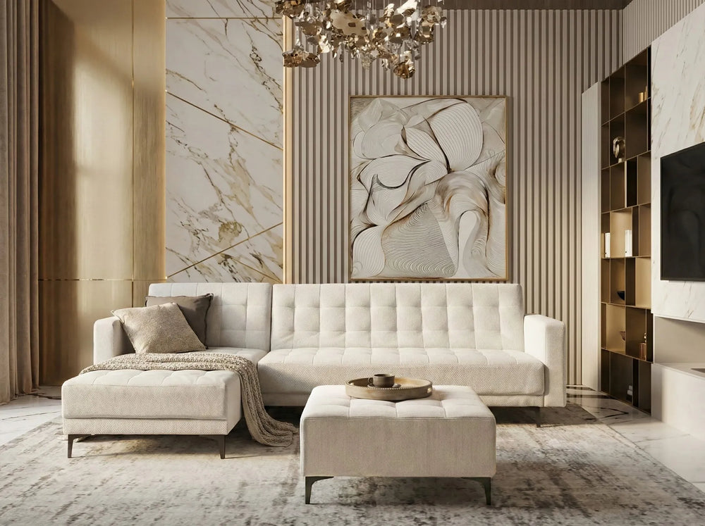 Luxurious living room with a beige sofa, ottoman, and decorative wall art.