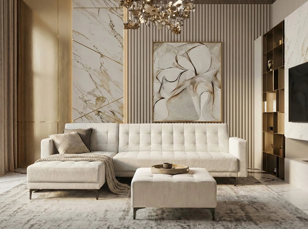 Luxurious living room with a beige sofa, ottoman, and decorative wall art.