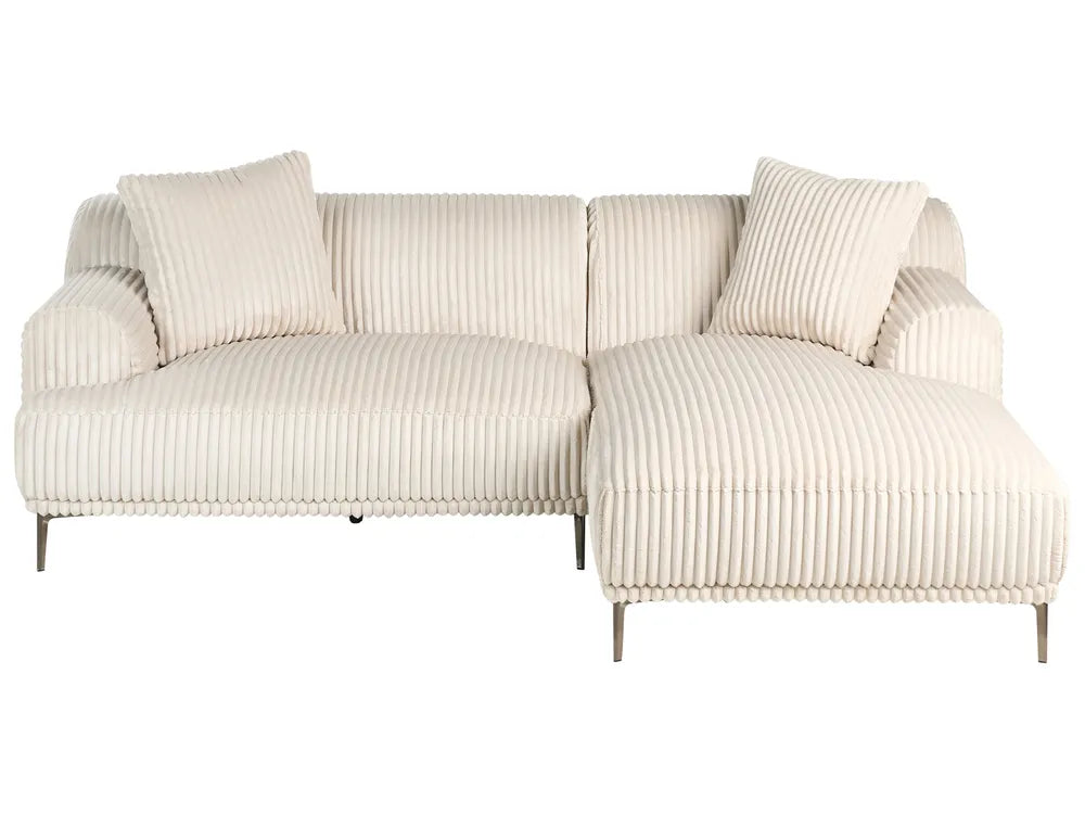 Beige ribbed sofa with cushions on a white background
