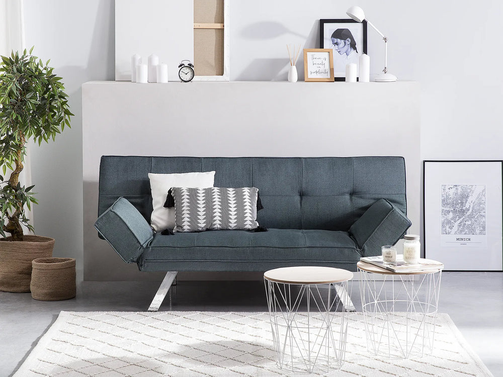 Gray sofa in a modern living room with decor elements.