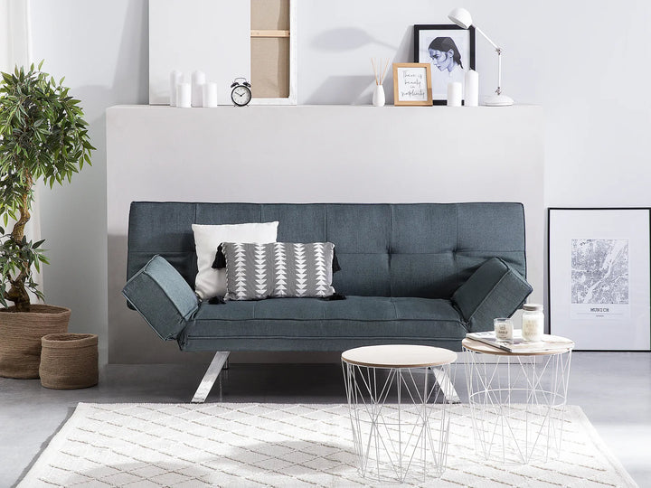 Gray sofa in a modern living room with decor elements.