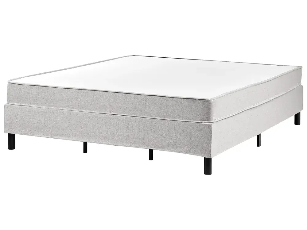 Gray bed frame with mattress on a white background