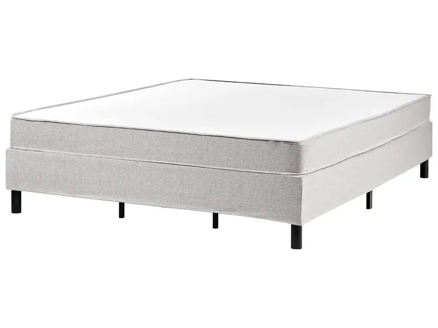 Gray bed frame with mattress on a white background