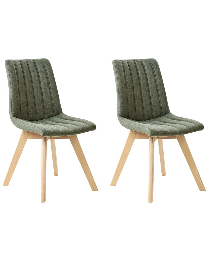 Two green chairs with wooden legs on a white background